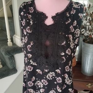 Floral top with feminine embroidery.